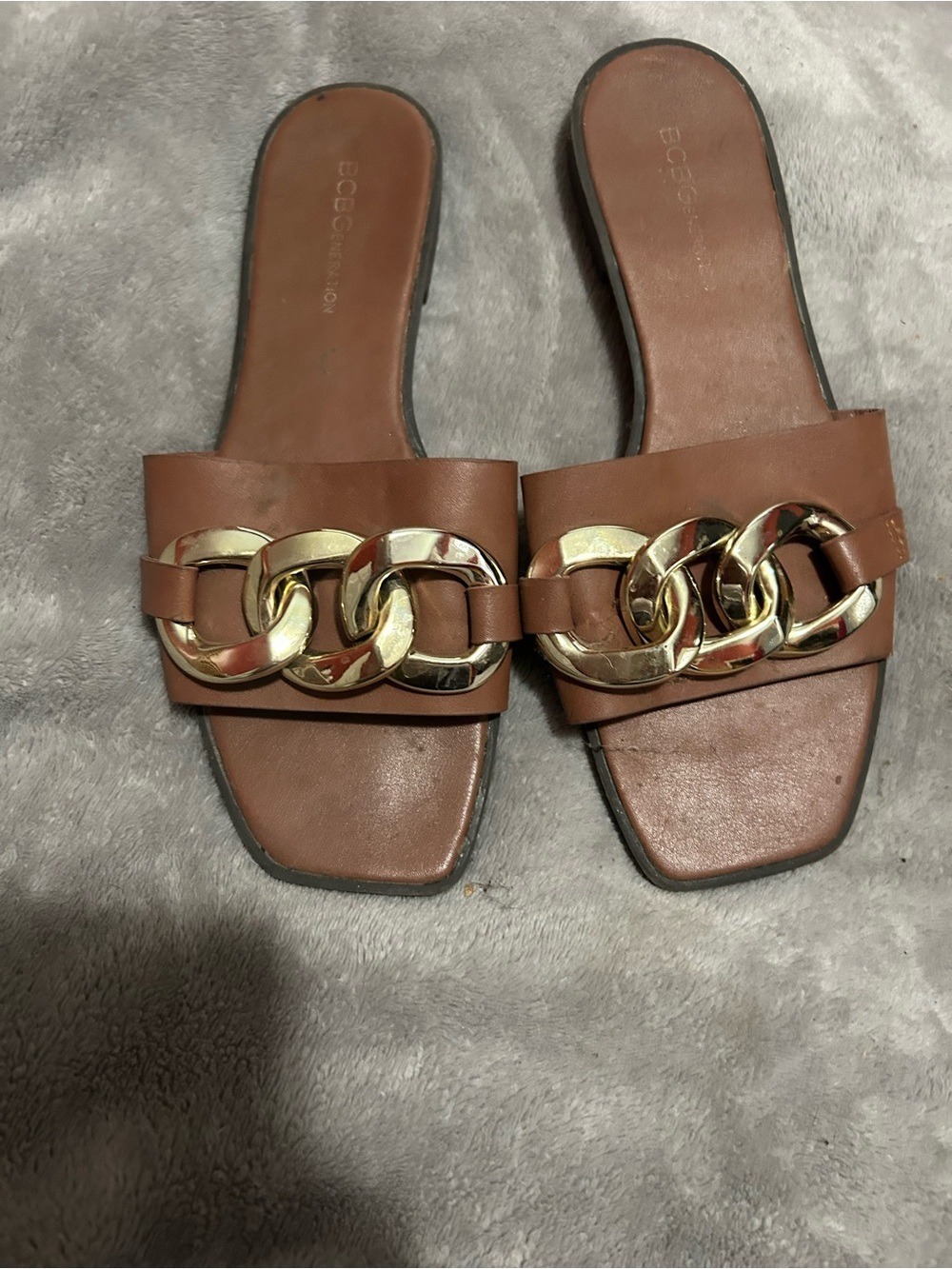 BCBGMaxAzria Brown Slide Sandals with Gold Chain Accent